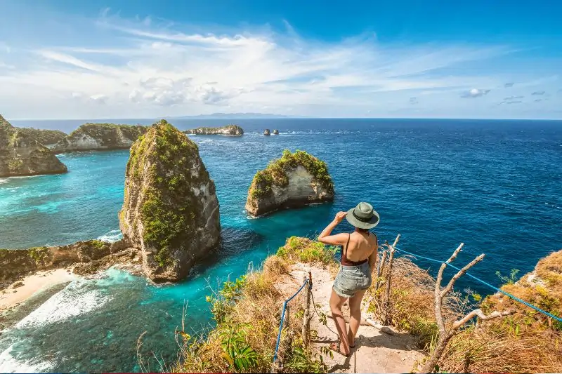 Bali, Indonesia, Traveler at Diamond Beach in Nusa Penida Island 