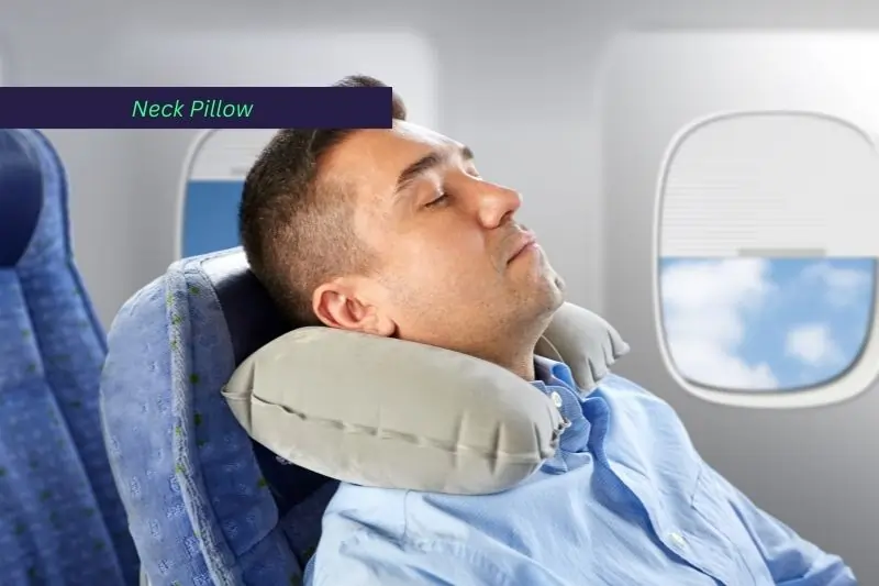 gift ideas for a traveling man, Man Sleeping in Plane with Neck Pillow