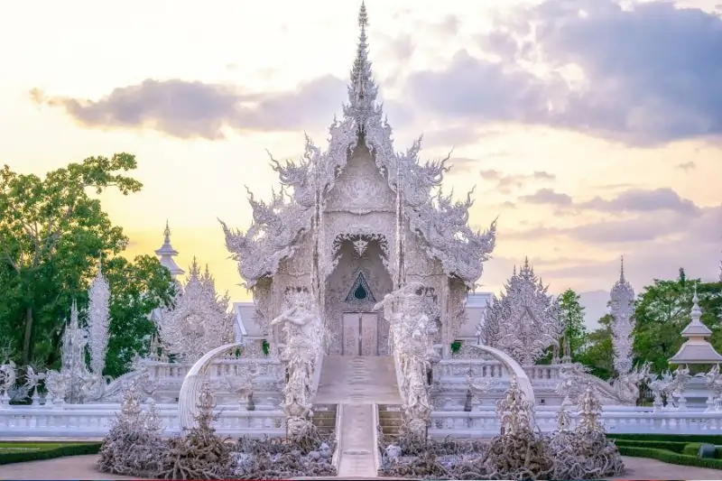 Wat Rong Khun. The bridge of "the cycle of rebirth": the main building at the white temple at Chiang Rai, Thailand